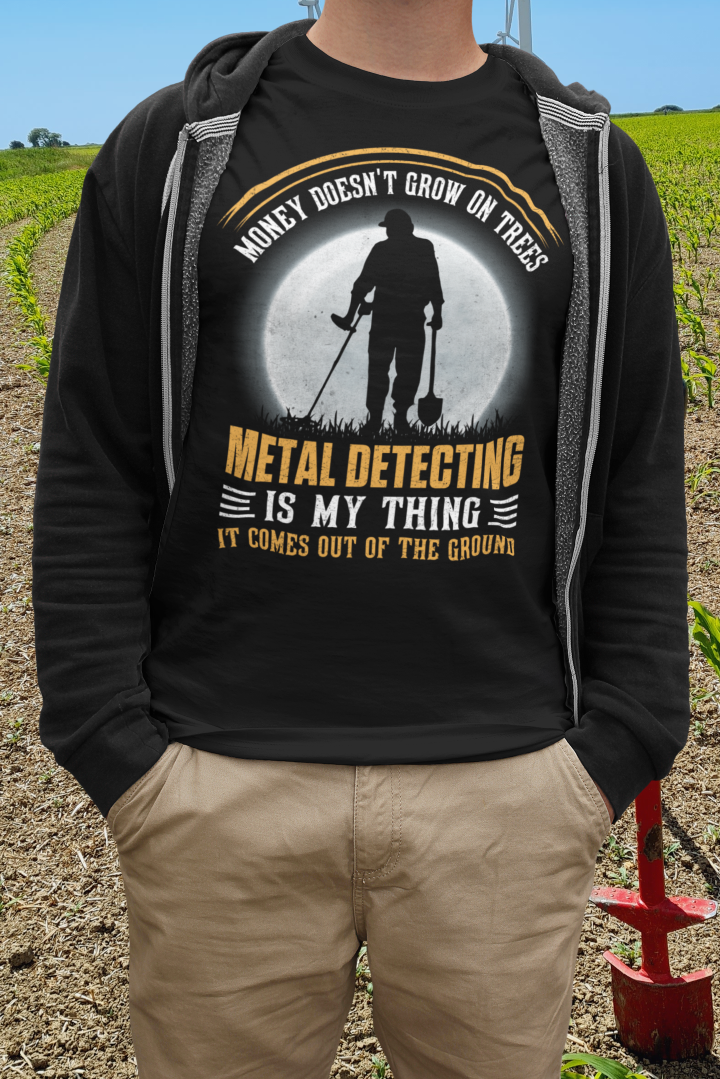 Money doesn't grow on trees, it comes out of the ground T-shirt