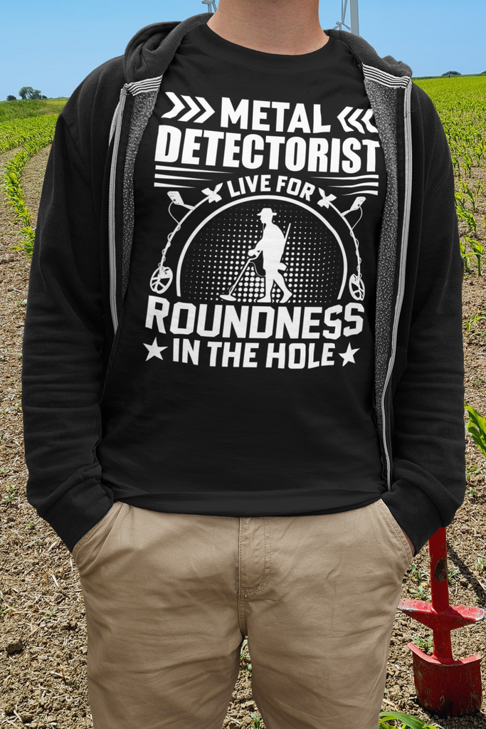 Metal detectorist, live for roundness in the hole